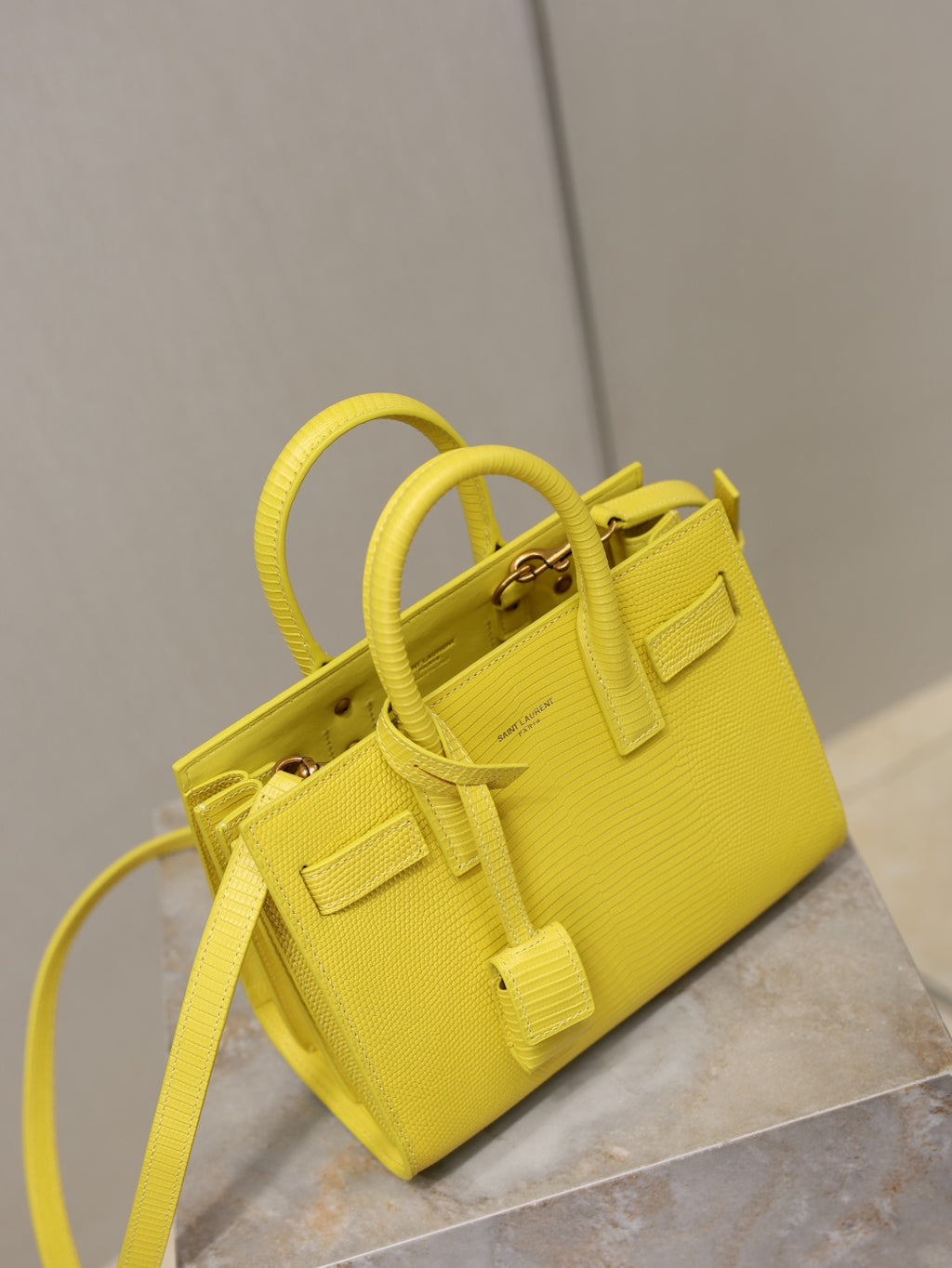 YSL yellow textured mini handbag with top handles and gold-tone hardware