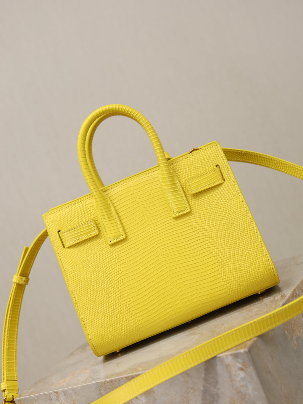 YSL yellow textured handbag with structured shape and shoulder strap