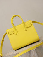 YSL yellow textured handbag with structured shape and shoulder strap
