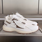 Dior unisex sneakers in white with brown accents and lace-up front, chunky sole