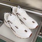 Dior unisex sneakers pair, white uppers with brown trim details and thick cushioned sole