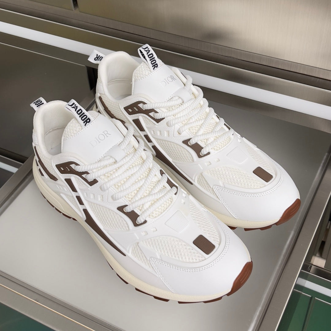 Dior unisex sneakers pair, white uppers with brown trim details and thick cushioned sole