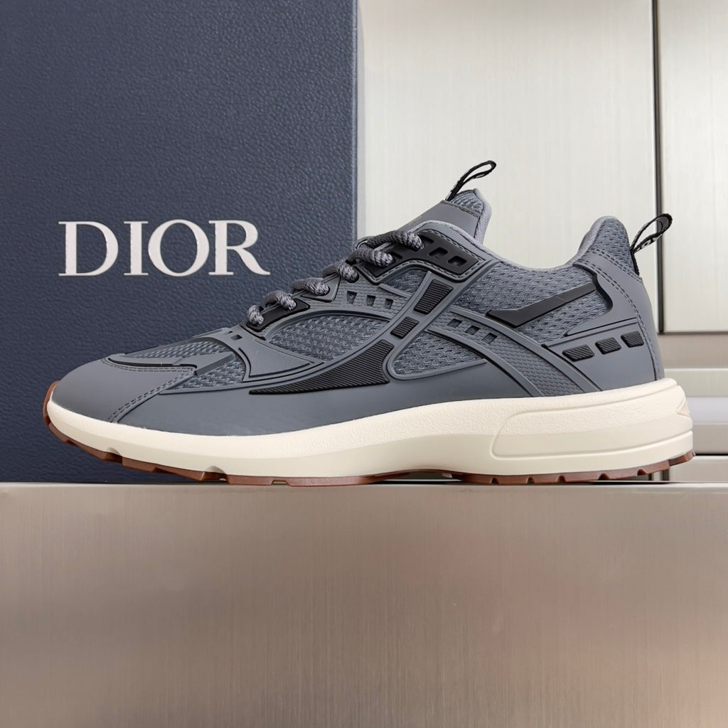 Unisex Dior lace-up sneakers in blue-gray with chunky off-white sole and side panels.