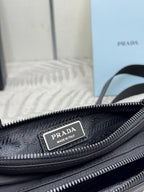 Black Prada bag close-up of inner logo label on zipper track and lining texture.
