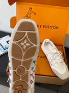 White sneaker outsole with patterned side accents and tread detail, shown with shoe