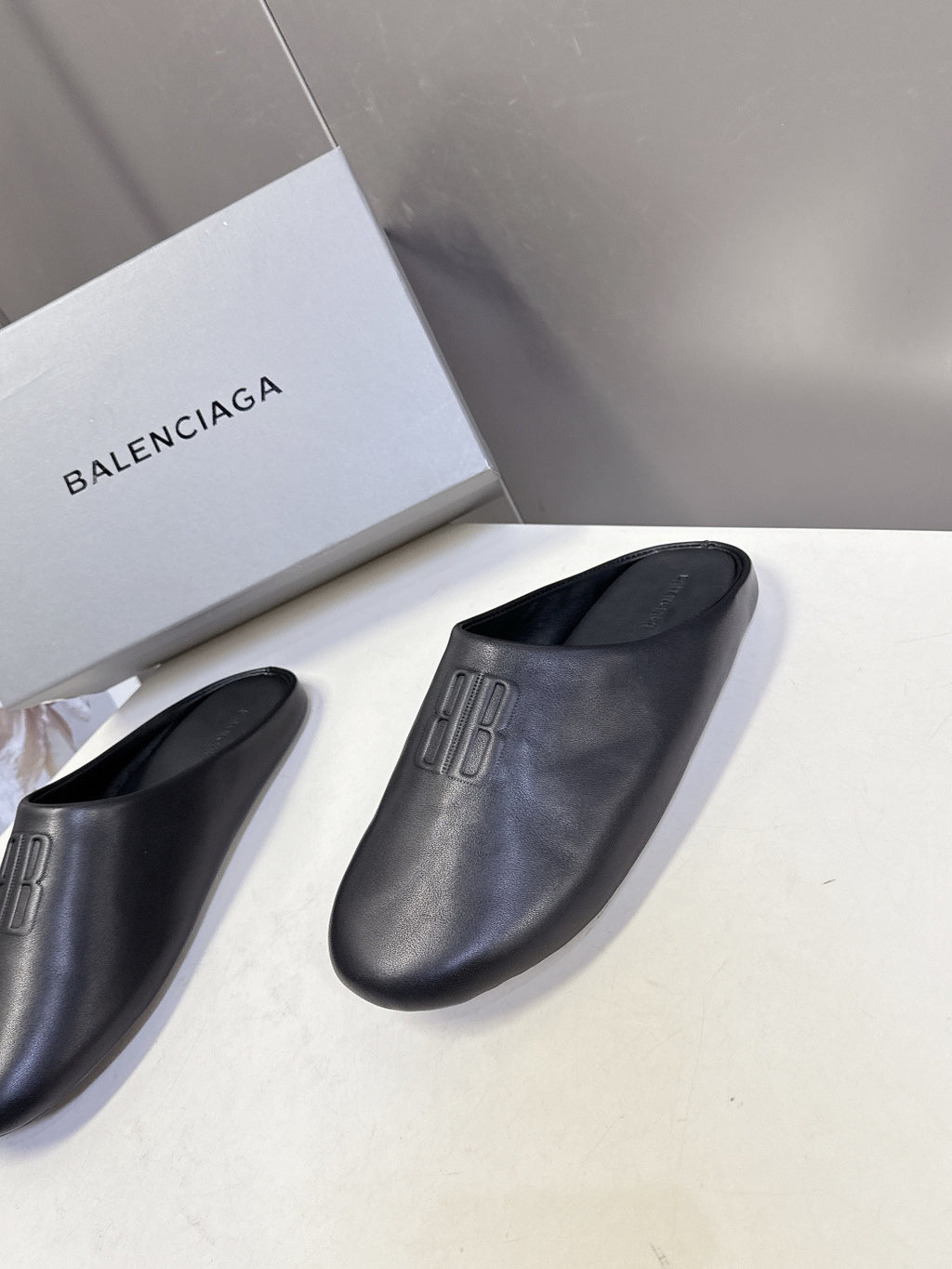 Balenciaga black slide sandals, open-toe slip-on style with embossed logo