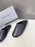 Balenciaga black slide sandals, open-toe slip-on style with embossed logo