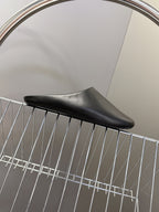 Balenciaga black slide sandal, low-profile sole and curved toe