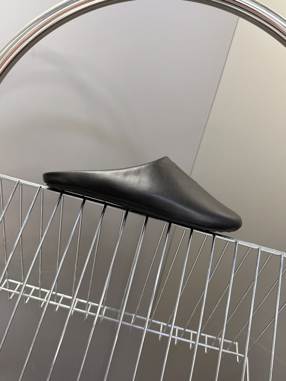 Balenciaga black slide sandal, low-profile sole and curved toe