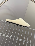 Balenciaga slide sandals, light beige, side profile with flat sole edge