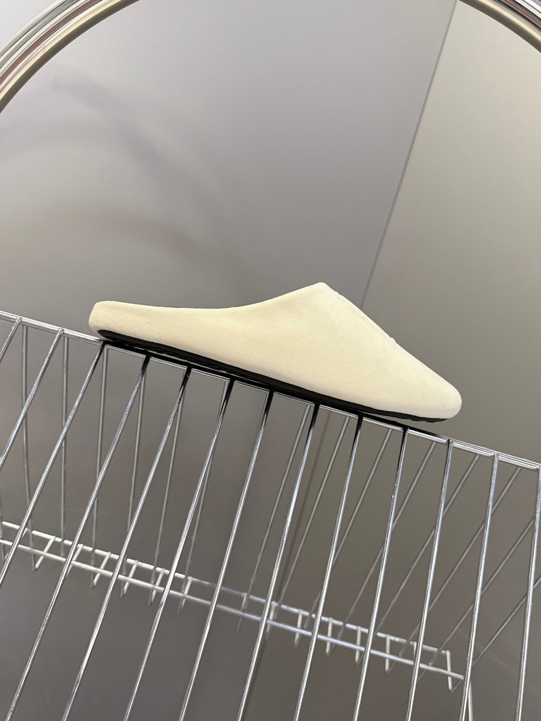 Balenciaga slide sandals, light beige, side profile with flat sole edge