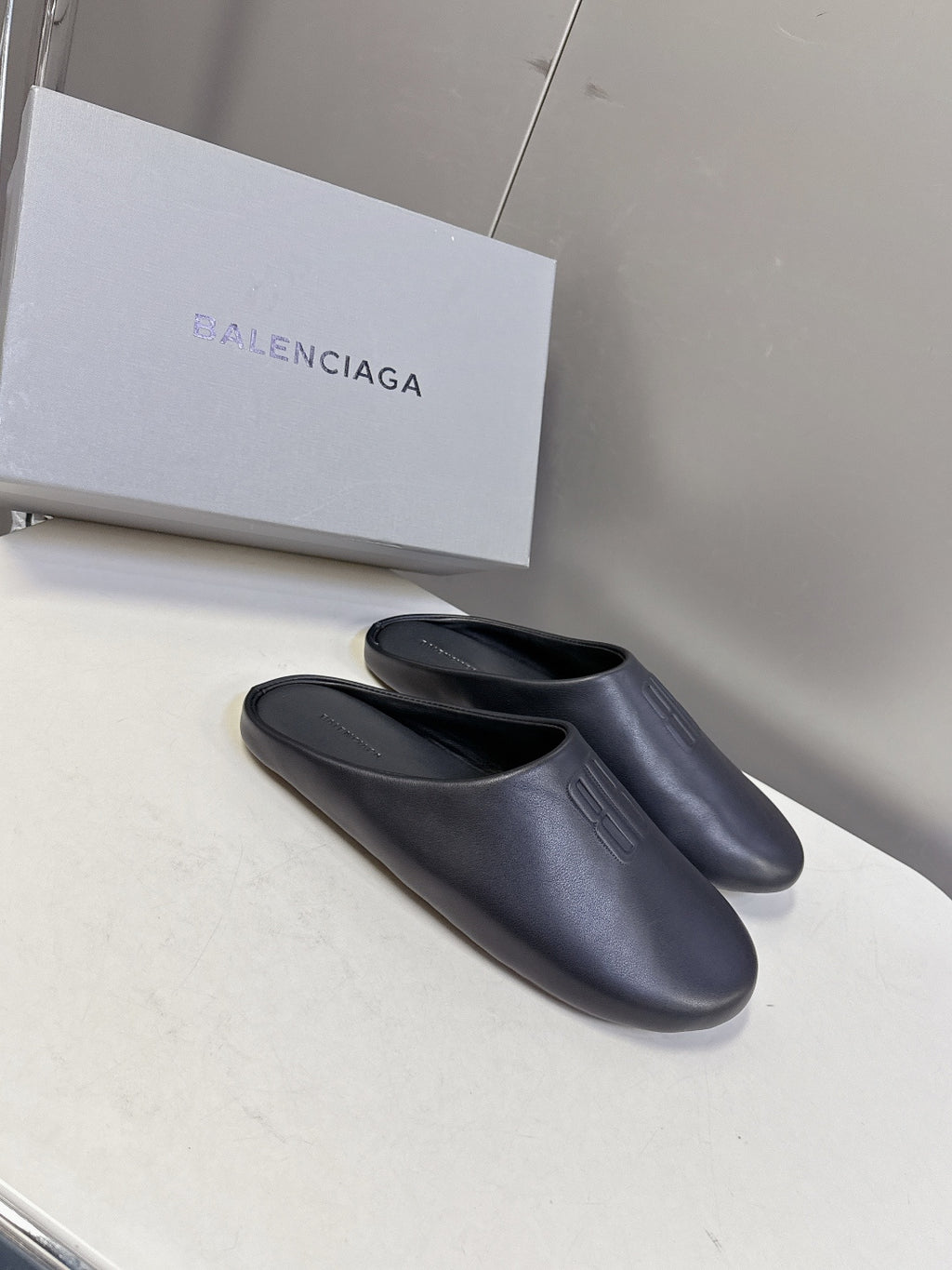 Balenciaga black slide sandals, smooth upper with embossed logo on strap