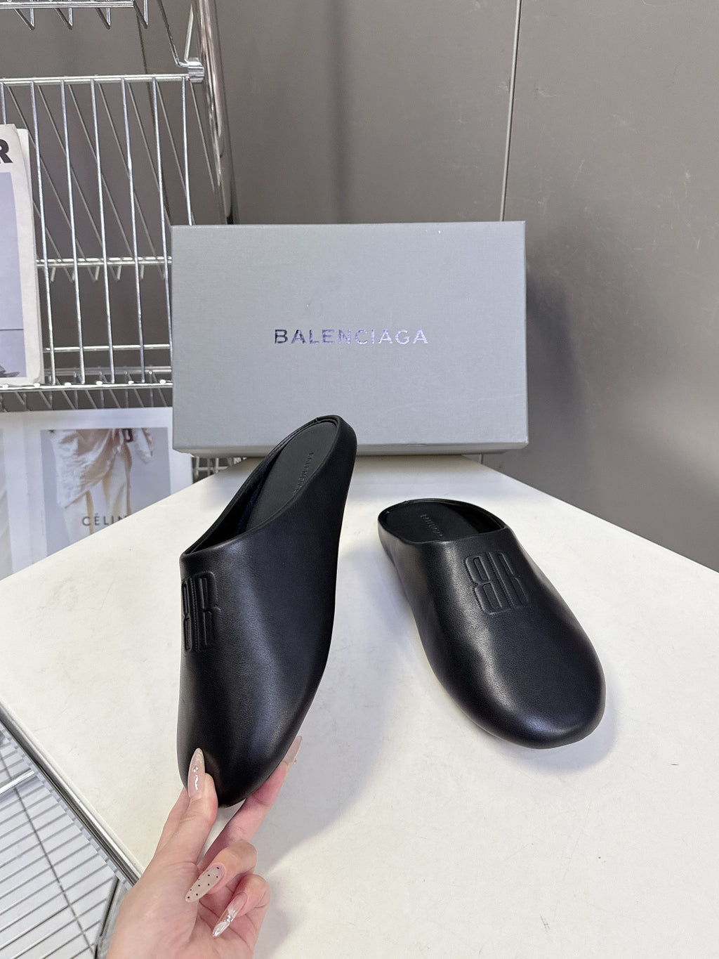 Balenciaga black slide sandal, smooth upper and embossed logo detail