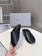 Balenciaga black slide sandal, smooth upper and embossed logo detail