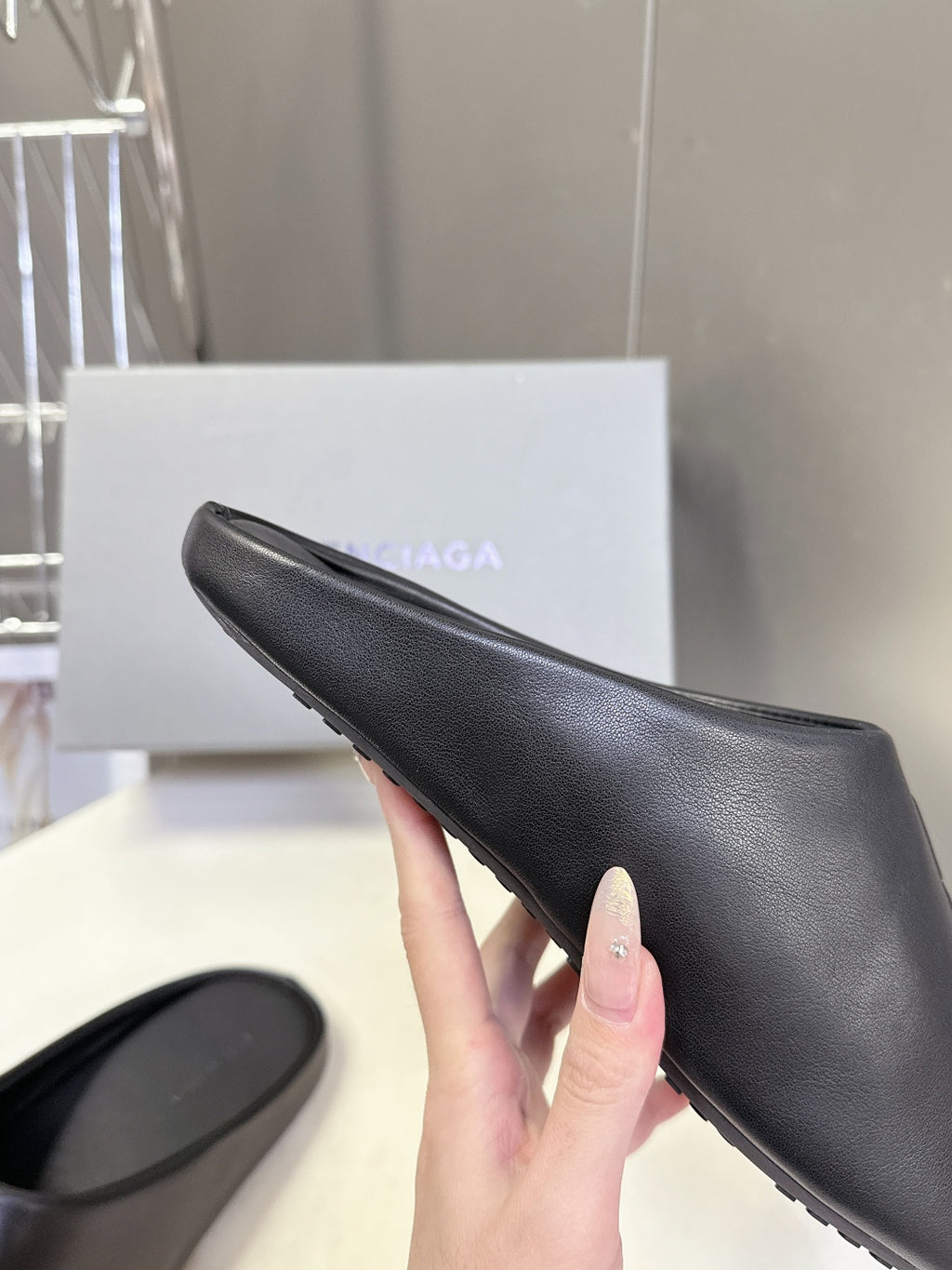 Balenciaga black slide sandal, textured upper with embossed logo on strap