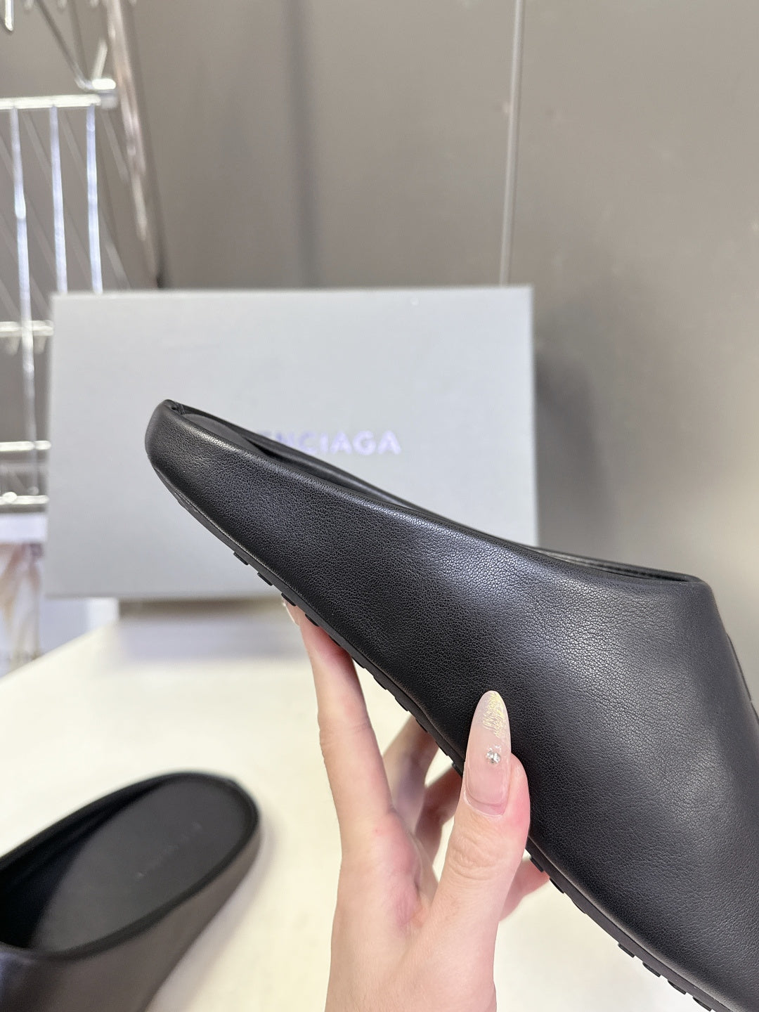 Balenciaga black slide sandal, textured upper with embossed logo on strap