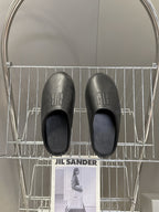Balenciaga black slide sandals, branding on footbed, open-toe silhouette