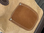 Beige monogram handbag front patch pocket with contrast white stitching and rivets