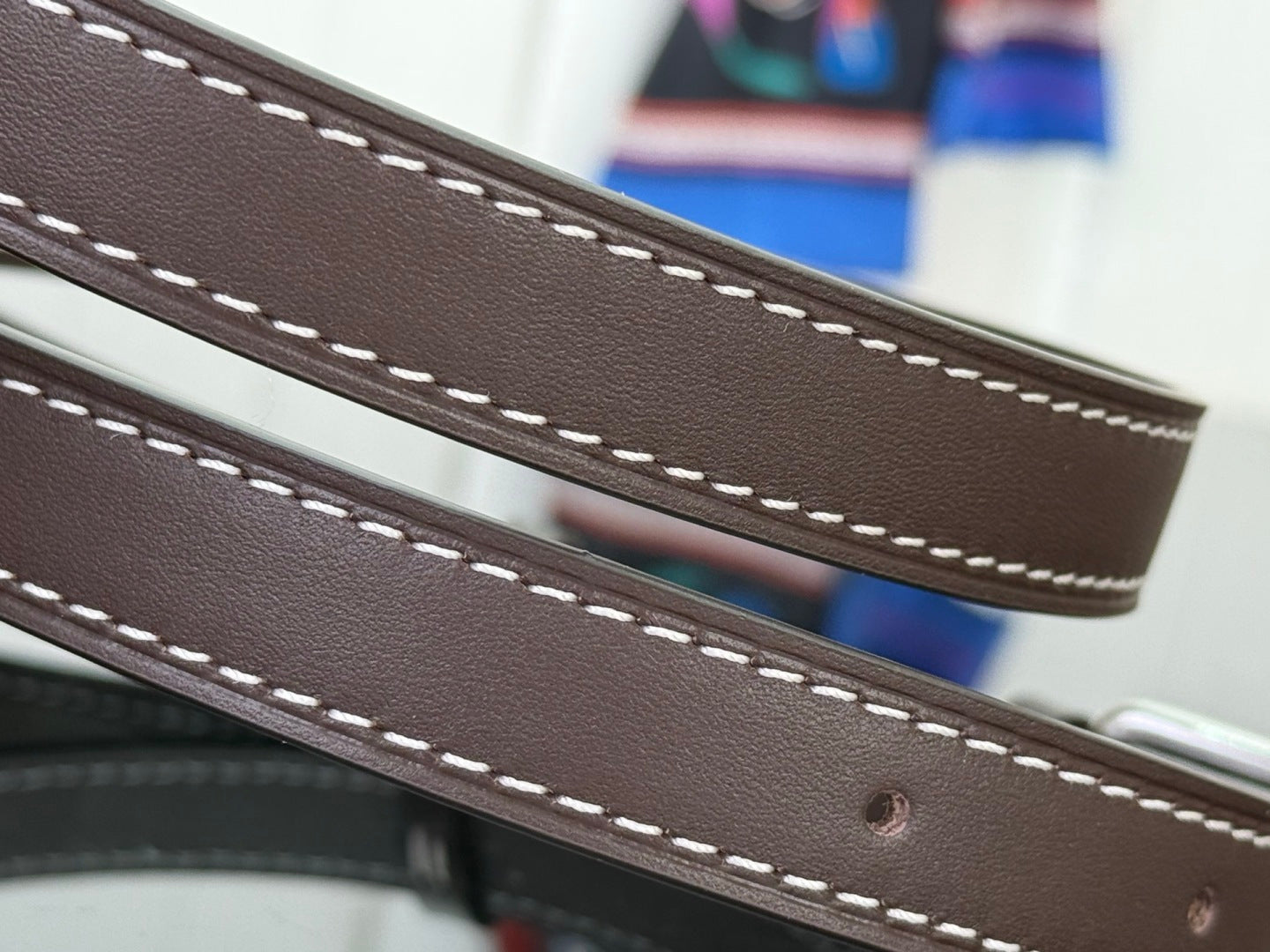 Louis Vuitton bag strap in dark brown leather with double white stitching