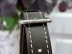 Top leather strap with metal buckle embossed Louis Vuitton on small bag
