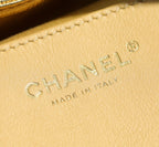 Gold leather patch with CHANEL logo and MADE IN ITALY embossing
