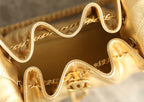 Chanel metallic-gold bag interior with chain hardware and zipper pull