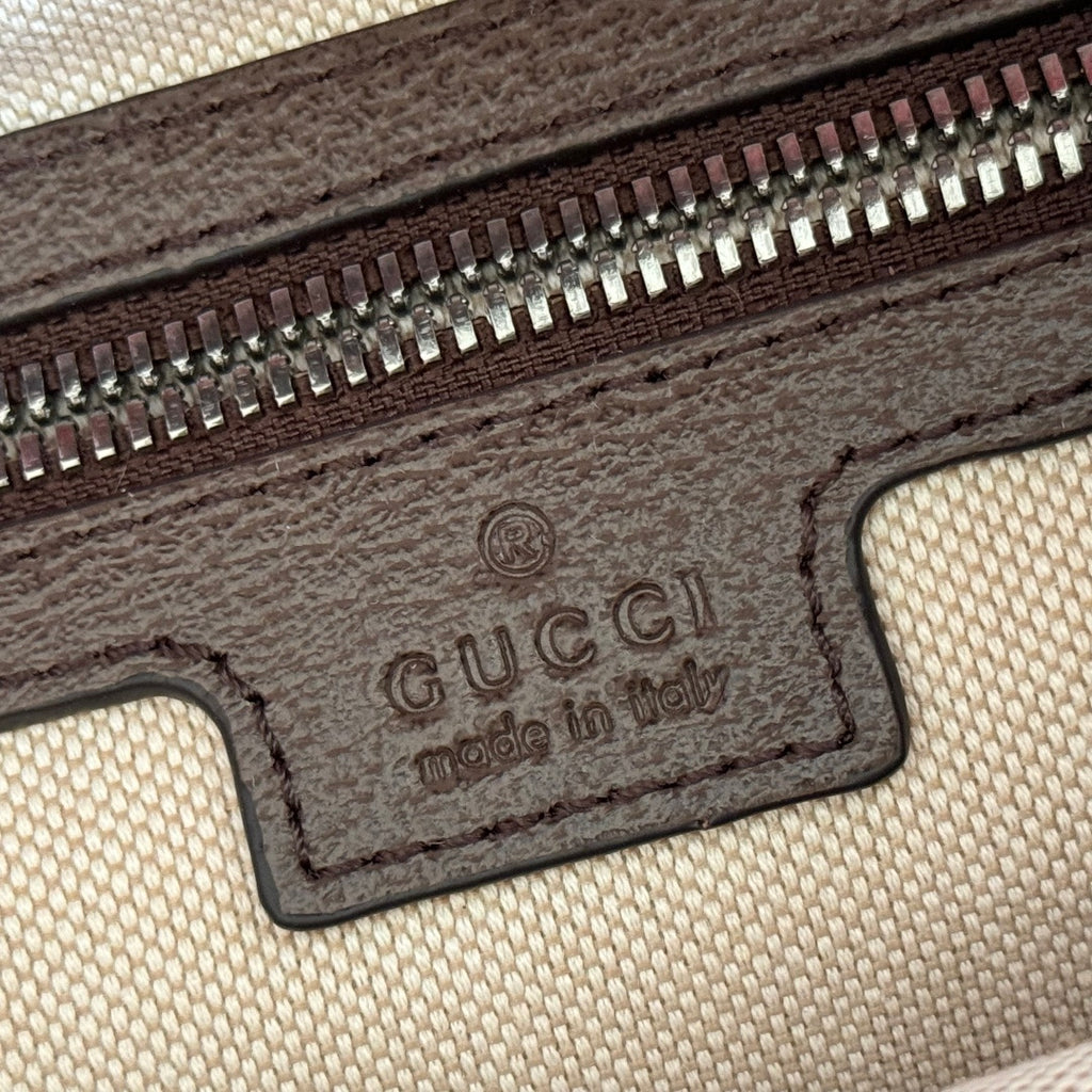 Gucci backpack interior label with “Gucci” and “made in Italy” branding