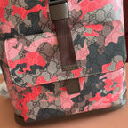 Gucci backpack lower front close-up with camo GG canvas and adjustable strap