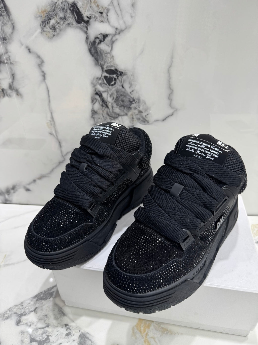 Amiri luxury shoes black lace-up sneakers with speckled toe and side details