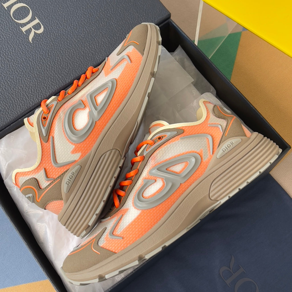 Dior unisex sneakers, side view with orange laces and ribbed gray rubber sole