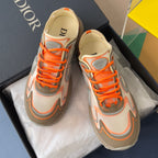 Dior unisex sneakers, front view with orange laces and beige interior