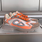 Dior unisex sneakers, orange laces and gray-orange patterned panels