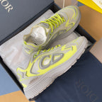 Dior unisex sneakers with neon lime trim, light gray uppers, lace-up style