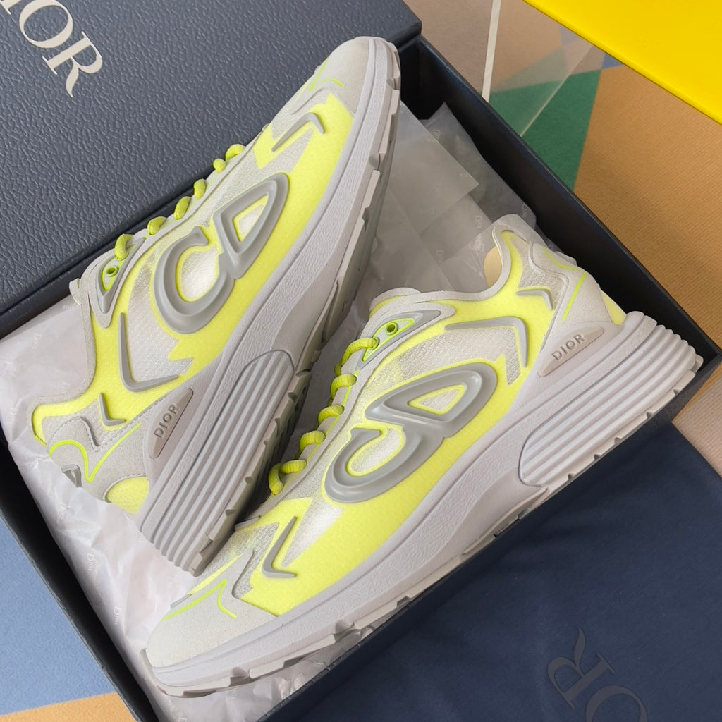 Dior unisex sneakers, angled view, neon lime accents on light gray with ridged sole