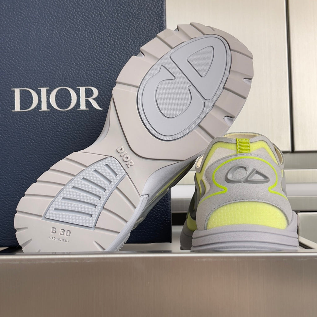 Dior unisex sneakers, outsole view, light gray tread with neon lime heel accents