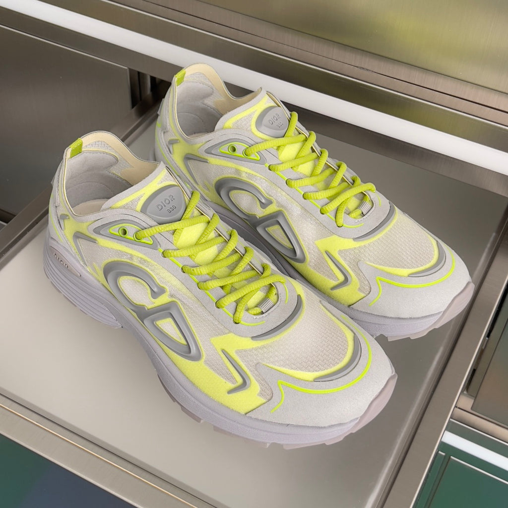 Dior unisex sneakers pair, light gray and neon lime, lace-up with chunky sole