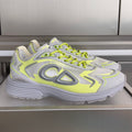Unisex Dior sneakers in light gray with neon lime laces and sculpted logo details