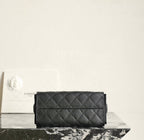 Black quilted flap shoulder bag with diamond pattern and rectangular front panel