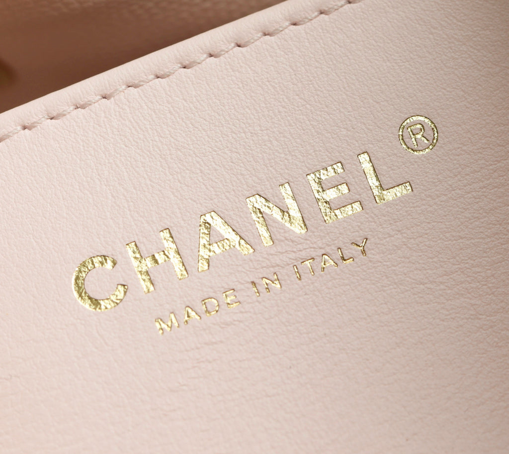 Pink Chanel leather with gold "CHANEL" and "MADE IN ITALY" emboss