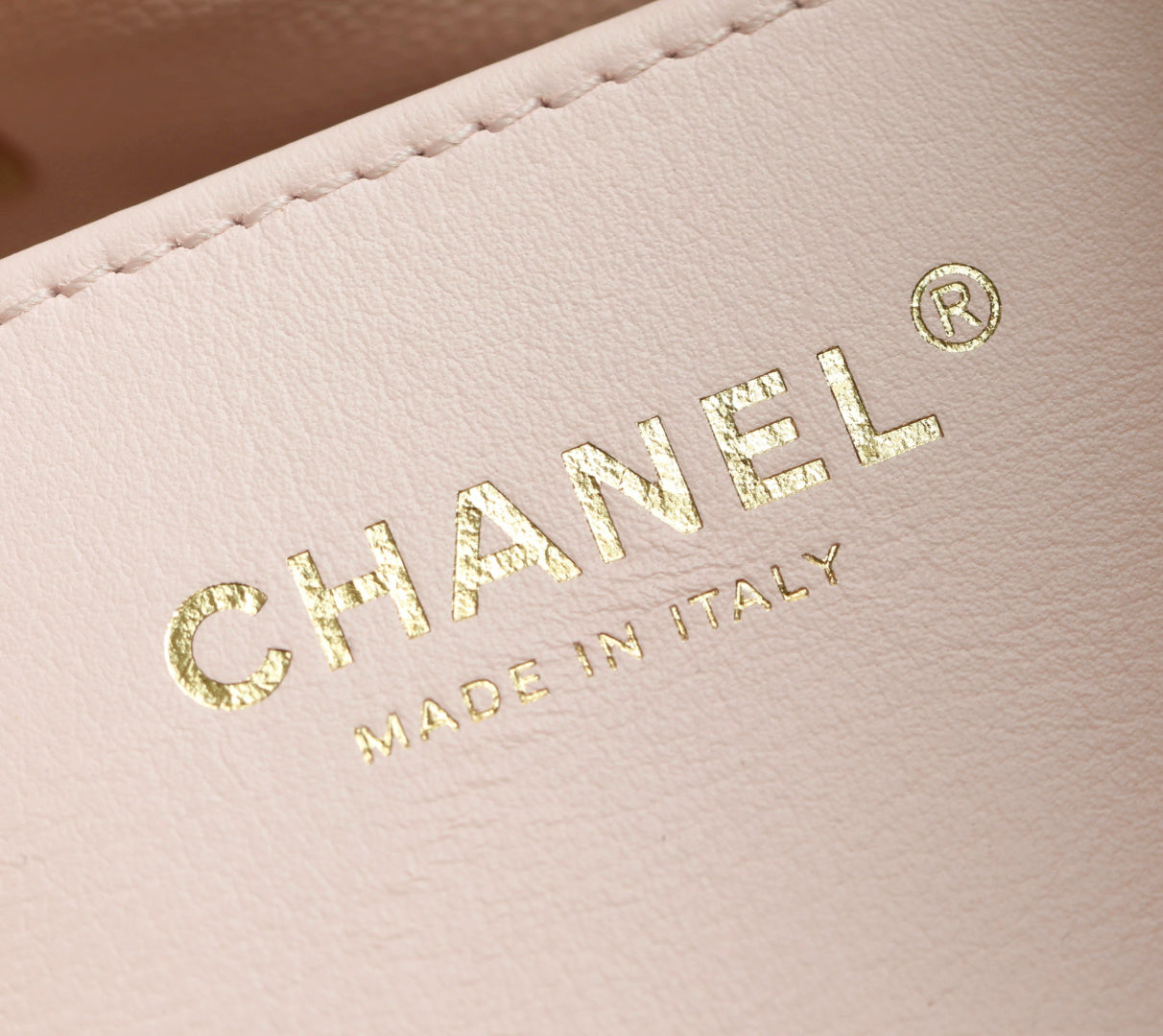 Pink Chanel leather with gold "CHANEL" and "MADE IN ITALY" emboss