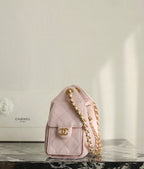 Pink Chanel shoulder bag with gold chain detail and logo front medallion