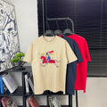 Burberry graphic T-shirt in light beige with multicolor rider and animal print
