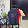 Navy short-sleeve T-shirt with colorful graphic print on front, crew neck.