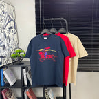 Navy short-sleeve T-shirt with colorful graphic print on front, crew neck.
