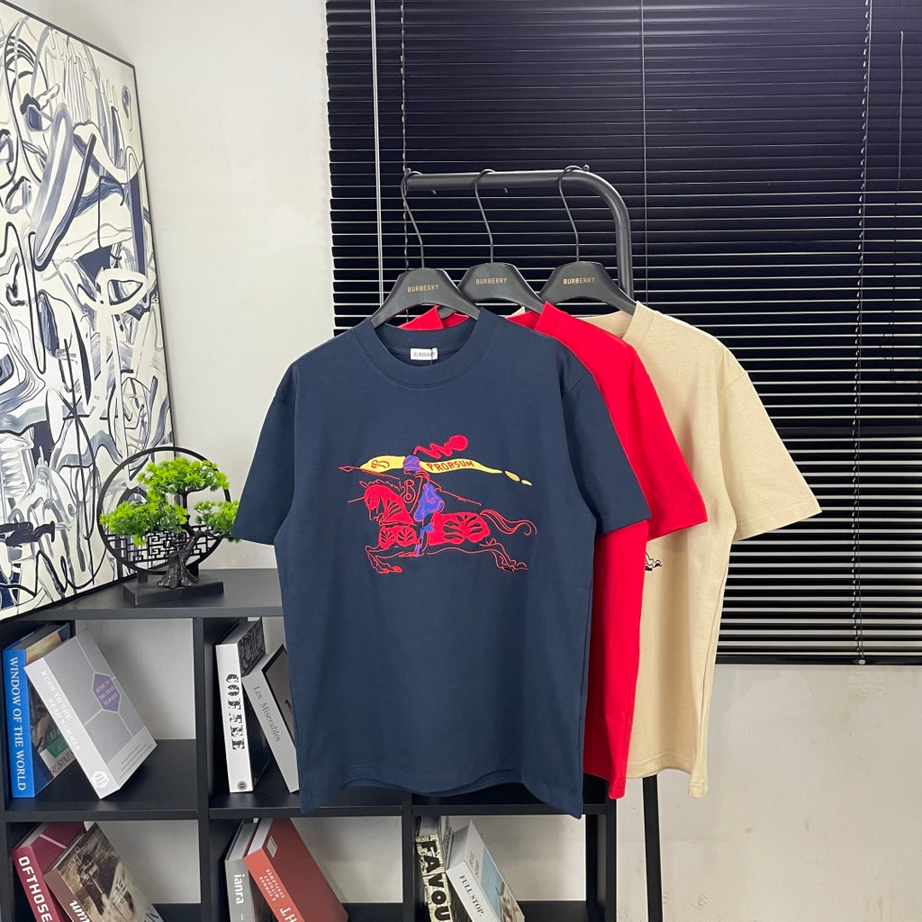 Burberry graphic T-shirt set with navy, red, and beige shirts; rider and animal print