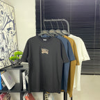 Men's short-sleeve t-shirt, dark color, small chest logo graphic