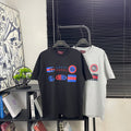 Gucci graphic T-shirt in dark blue with colorful logos on front
