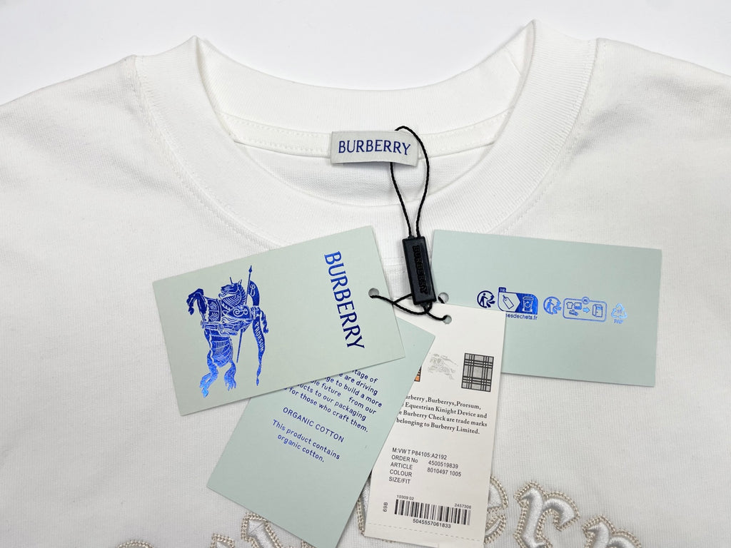 White crewneck T-shirt with Burberry logo, tag and product booklet attached