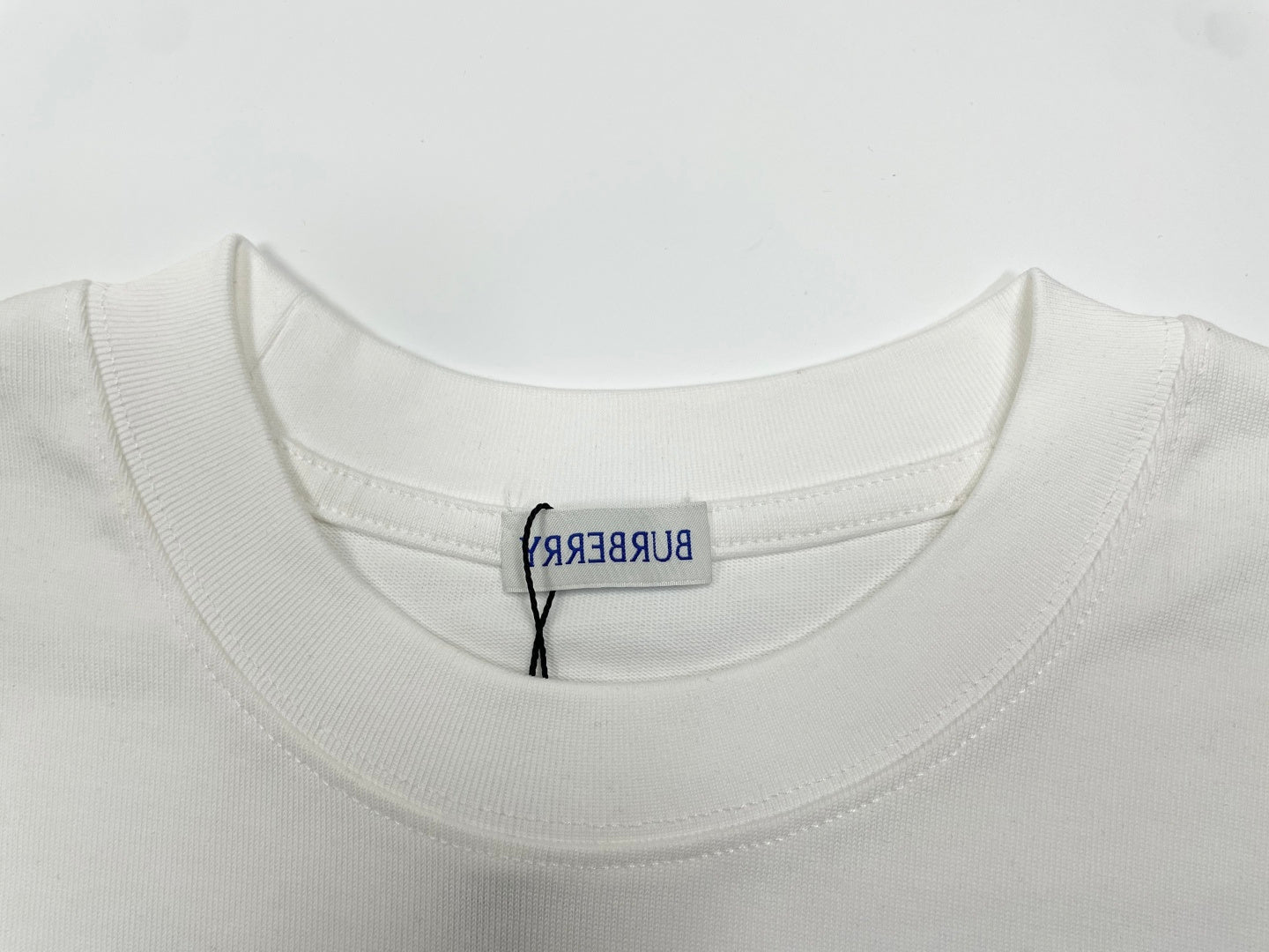 White crewneck T-shirt collar with embroidered Burberry label at neckline