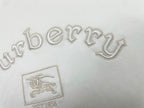 White T-shirt close-up with jeweled-style Burberry wordmark and crest